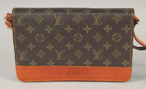 A LOUIS VUITTON LEATHER BAG in original box.