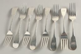 A COMPOSITE SET OF EIGHT GEORGE III SILVER SCOTTISH FIDDLE PATTERN TABLE FORKS. Edinburgh 1815 and