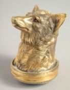 A GOOD RUSSIAN SILVER GILT DOG'S HEAD SNUFF BOX, 2.5ins long with blue enamel and diamond base. Mark