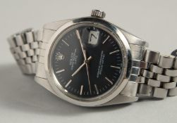 A ROLEX PERPETUAL OYSTER DAY DATE WRISTWATCH with slate grey dial, no. 74, in original box.