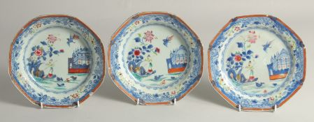 THREE CHINESE EXPORT BLUE AND WHITE / FAMILLE ROSE OCTAGONAL PORCELAIN DISHES, each painted