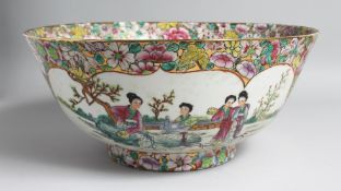 A LARGE CHINESE CANTON PORCELAIN PUNCH BOWL, the interior painted with female figures in a garden,