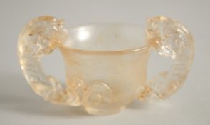 A CHINESE KUI DRAGON GLASS TWIN-HANDLE LIBATION CUP. 10cm handle to handle