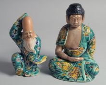 TWO JAPANESE TURQUOISE GLAZE PORCELAIN FIGURES, 18cm and 15cm.