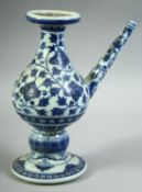 A CHINESE BLUE AND WHITE MING STYLE PORCELAIN WATER DROPPER, painted with floral decoration, the
