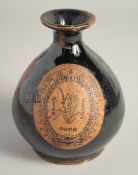 A CHINESE GLAZED POTTERY LIQUOR BOTTLE, 15.5cm high.