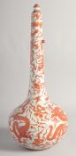 A LARGE CHINESE IRON RED AND WHITE PORCELAIN LIDDED BOTTLE VASE, painted with dragons and objects,