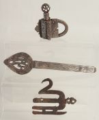 AN ISLAMIC STEEL PADLOCK, together with two other steel items; alam finial and helmet noseguard, (