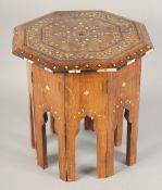 A SMALL MOORISH OCTAGONAL TABLE with folding base, with inlaid bone decoration, 31cm diameter,