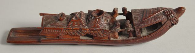A CHINESE CARVED WOOD MODEL OF A BOAT, 22cm long.