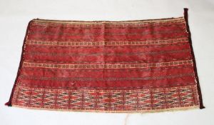 AN UZBEK EMBROIDERED TEXTILE, 137cm x 76cm.