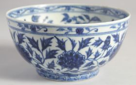 A CHINESE BLUE AND WHITE PORCELAIN BOWL, painted with flora, the base with six-character mark, 15.