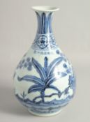 A CHINESE BLUE AND WHITE PORCELAIN VASE, decorated with native flora, bearing a six-character