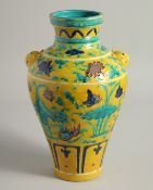 A CHINESE FAHUA PORCELAIN VASE with moulded twin handles and raised decoration depicting ducks and