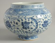 A CHINESE BLUE AND WHITE PORCELAIN JAR, painted with flowers and scrolling vine beneath a band of