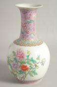 A CHINESE FAMILLE ROSE PORCELAIN BOTTLE VASE, decorated with flora, the reverse with script, the
