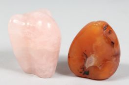 A NATURALISTIC FORM ROSE QUARTZ PIECE, together with another hard stone, (2).