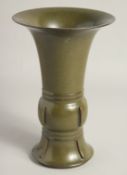 A CHINESE TEA DUST GLAZE GU VASE, the base with impressed six-character mark, 28cm high.