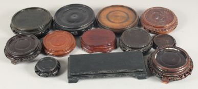 A GOOD COLLECTION OF CHINESE HARDWOOD STANDS, various sizes, (12).