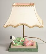 A 19TH CENTURY CHINESE FAMILLE ROSE PORCELAIN WALL FIGURE, mounted to the base of a lamp, figure,
