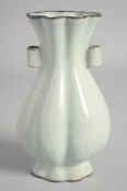 A CHINESE GUAN STYLE TWIN HANDLE VASE, 19cm high.