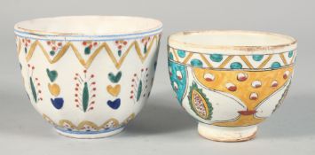 TWO TURKISH KUTAHYA POTTERY BOWLS, each painted with decorative floral motifs, 10cm and 9cm