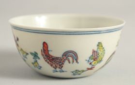 A CHINESE DOUCAI PORCELAIN CHICKEN CUP, 8cm diameter.