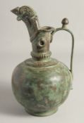 A LARGE SELJUK STYLE BRONZE EWER, with engraved decoration to the neck and spout, drop rings, and
