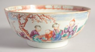 A CHINESE MANDARIN FAMILLE ROSE PORCELAIN BOWL, painted with panels of figures in an outdoor