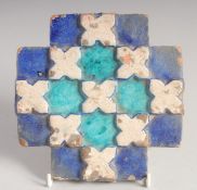 A FINE 18TH CENTURY INDIAN MULTAN TILE, with raised geometric decoration. 16cm square