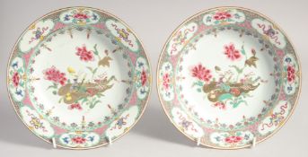 A PAIR OF CHINESE FAMILLE ROSE PORCELAIN DISHES, painted with a central floral motif with various