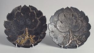 A FINE PAIR OF 19TH CENTURY INDIAN PUNJAB KOFTGARI SILVER INLAID STEEL DISHES, of foliate design,