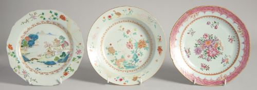 THREE CHINESE FAMILLE ROSE PORCELAIN PLATES, one painted with a crane and flora, another with a