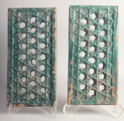 A FINE PAIR OF 18 CENTURY INDIAN MUGHAL GLAZED POTTERY JALI OPENWORKED TILES. Each 37cm x 18.5cm