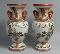 A PAIR OF JAPANESE KUTANI PORCELAIN TWIN HANDLE VASES, painted with figures in outdoor scenes and