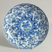 A LARGE CHINESE BLUE AND WHITE PORCELAIN PLATE, possibly Kangxi, painted with panels of native