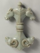 A LARGE MUGHAL STYLE CARVED JADE SWORD / DAGGER HANDLE, carved to one end with double-headed