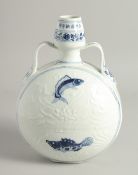 A CHINESE BLUE AND WHITE PORCELAIN TWIN HANDLED MOON FLASK, painted with fish and lotus, and further