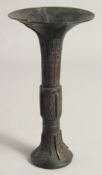 A CHINESE BRONZE GU SHAPE VASE, possibly Ming, 22cm high.