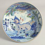 A CHINESE DOUCAI-TYPE PORCELAIN PEDESTAL DISH, painted with a mythological beast and phoenix, the