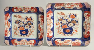 TWO JAPANESE IMARI PORCELAIN SQUARE FORM DISHES, each painted with a central vase of flowers beneath
