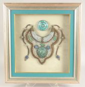 A LARGE DECORATIVE TRIBAL NECKLACE, with applied bead work, pearl and turquoise decoration, framed