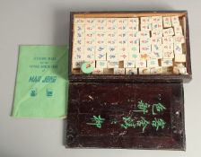 A CHINESE MAHJONG SET, with bone counters in a lidded box.