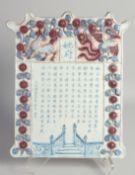 A CHINESE BLUE, WHITE AND COPPER RED PORCELAIN PLAQUE, painted with script, 36cm x 26cm.