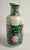 A LARGE CHINESE FAMILLE NOIR PORCELAIN VASE, painted with large flower heads and scrolling vine,