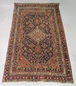 A LARGE PERSIAN QASHQAI RUG, rich blue ground with geometric decoration within a similar multi-row