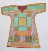 AN OTTOMAN HAND PAINTED COTTON SHIRT, the front with various colour panels decorated with