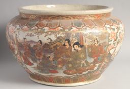 A VERY LARGE 19TH CENTURY JAPANESE SATSUMA BOWL, painted with panels of various figures and