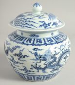 A LARGE CHINESE BLUE AND WHITE PORCELAIN GINGER JAR AND COVER, the jar painted with dragons