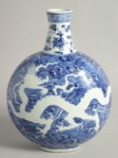 A CHINESE BLUE AND WHITE PORCELAIN MOON FLASK decorated with a white dragon against waves, with